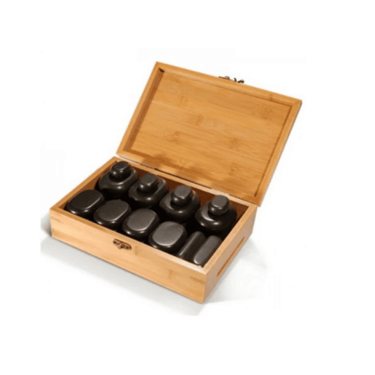Set of basalt hot stone in a wooden box on a white background